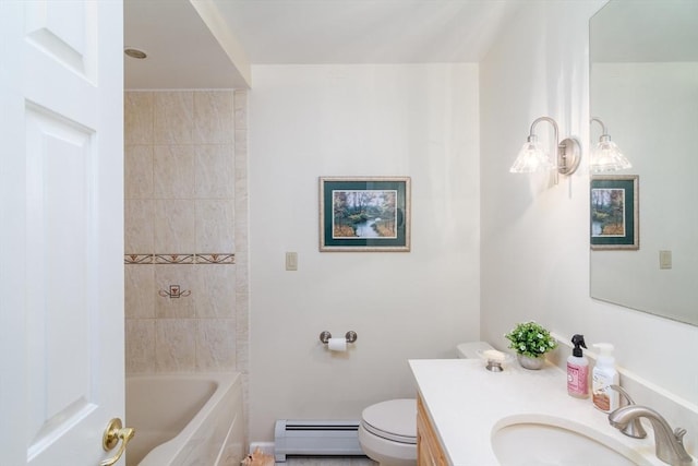 full bathroom featuring toilet, baseboard heating, tiled shower / bath, and vanity