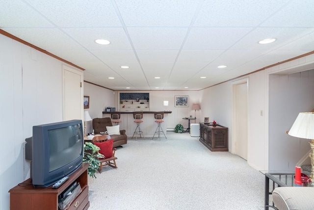 living area with indoor bar, carpet floors, and a drop ceiling