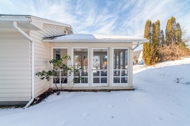 view of snow covered property entrance