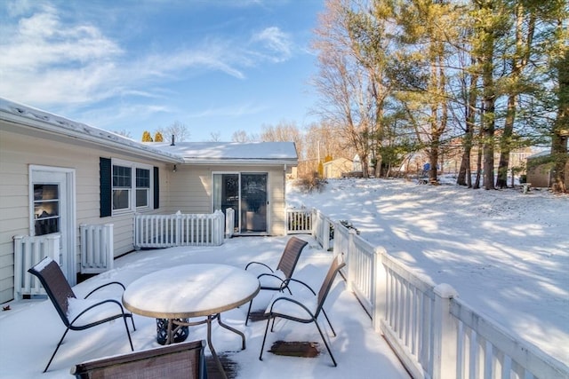 view of snow covered deck