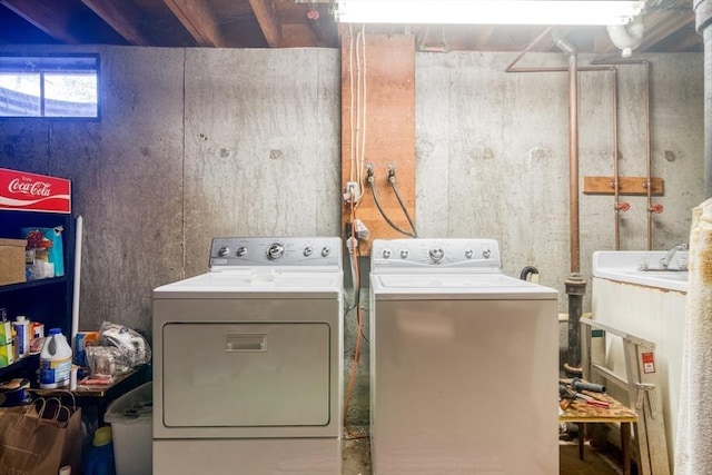 washroom with sink and washing machine and dryer