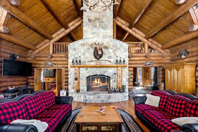 living room with wooden ceiling, log walls, hardwood / wood-style flooring, and beamed ceiling