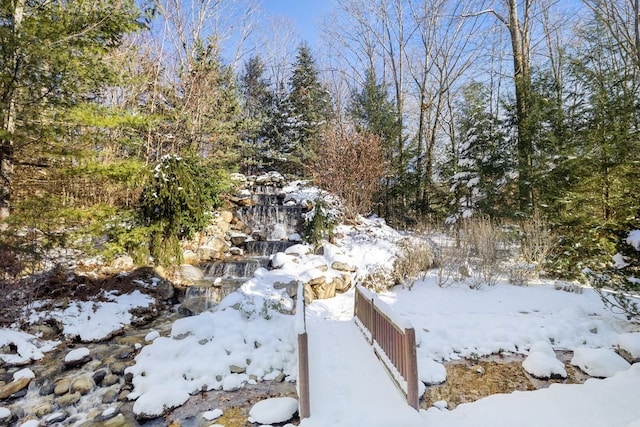 view of yard layered in snow