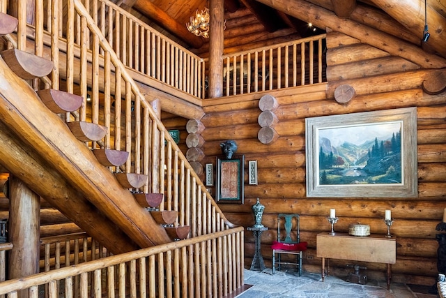 stairs with rustic walls and a towering ceiling