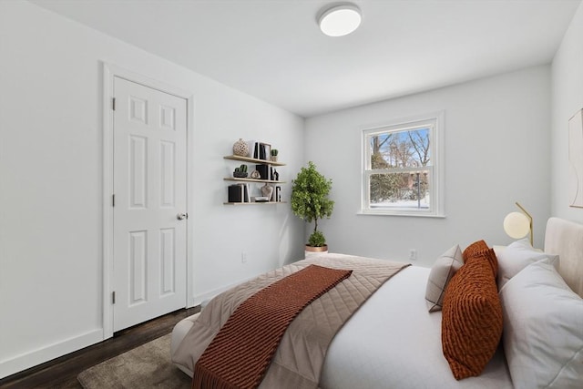 bedroom featuring dark wood-type flooring