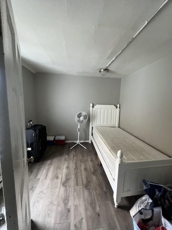 unfurnished bedroom featuring hardwood / wood-style flooring