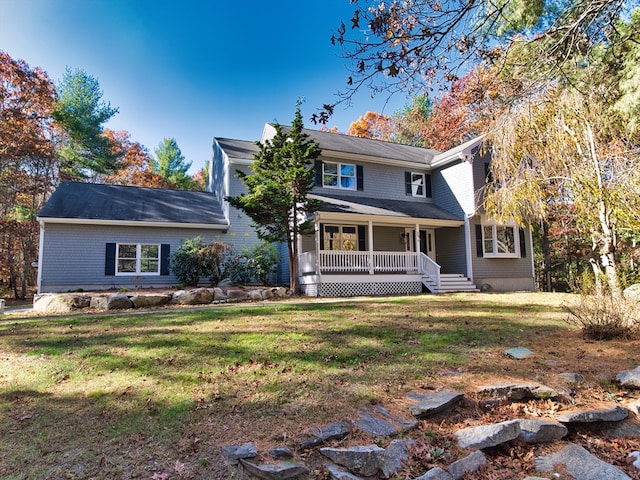 view of front of house with a front lawn and a porch