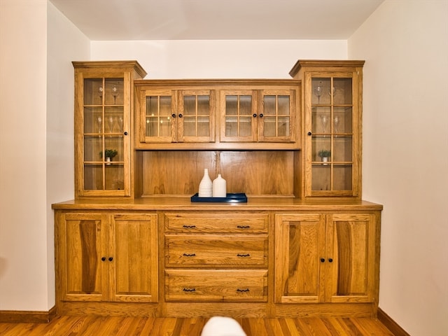 bar with wood-type flooring