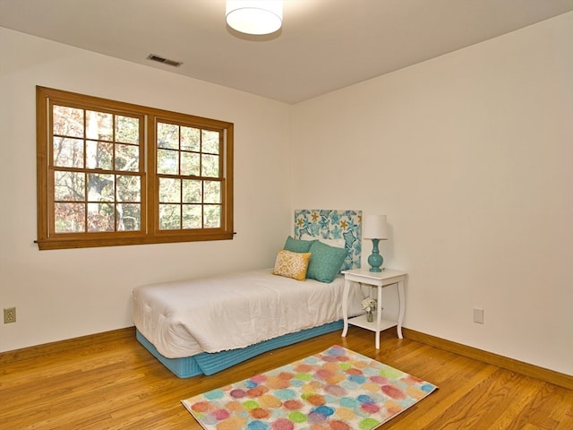 bedroom featuring wood-type flooring