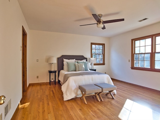 bedroom featuring light hardwood / wood-style flooring and ceiling fan