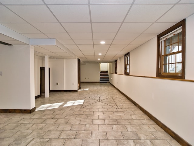 basement featuring a paneled ceiling