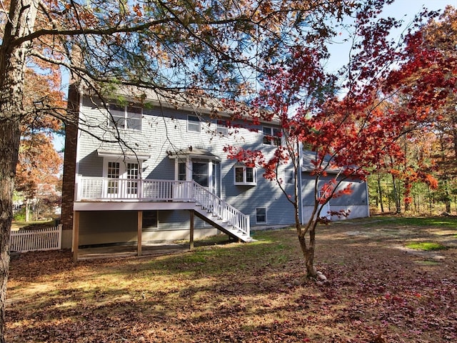 rear view of house featuring a deck