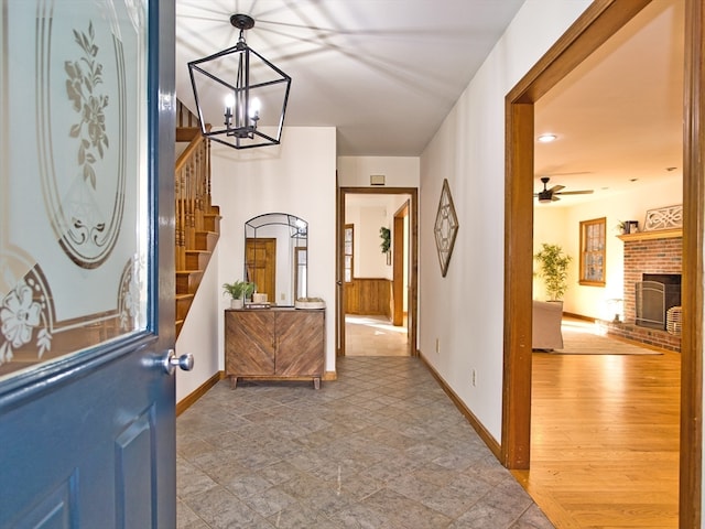 interior space with a fireplace, hardwood / wood-style flooring, and ceiling fan