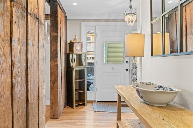 interior space featuring a chandelier and wood finished floors