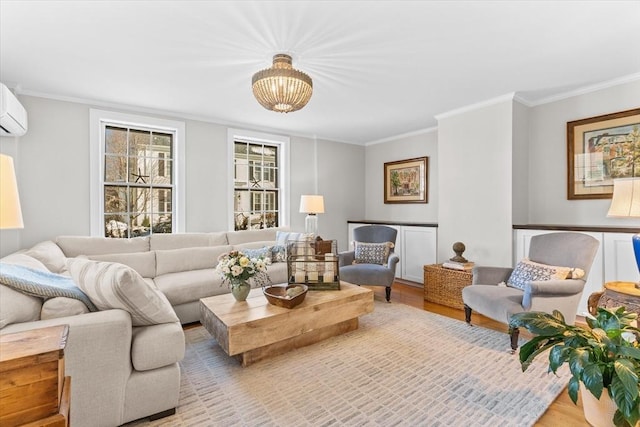 living room with light wood-type flooring and crown molding