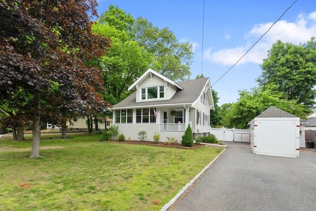 121 W St, Braintree, MA 02184 - bungalow featuring a gate, a porch, a shingled roof, and asphalt driveway