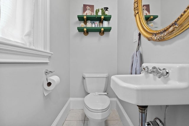 121 W St, Braintree, MA 02184 - half bathroom featuring toilet, tile patterned floors, and baseboards