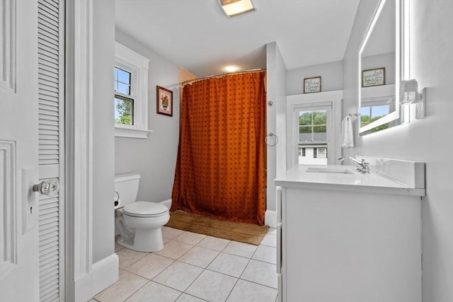 121 W St, Braintree, MA 02184 - bathroom with toilet, vanity, plenty of natural light, and tile patterned floors
