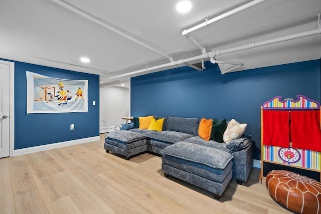 121 W St, Braintree, MA 02184 - living area with wood finished floors, baseboards, and recessed lighting