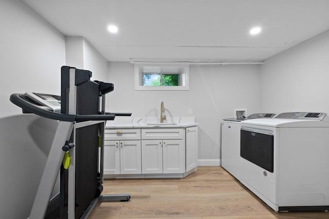 121 W St, Braintree, MA 02184 - laundry area with washer and clothes dryer, cabinet space, light wood-type flooring, and recessed lighting