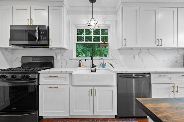 121 W St, Braintree, MA 02184 - kitchen featuring stainless steel appliances, a sink, and white cabinets