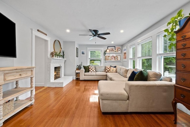 121 W St, Braintree, MA 02184 - living area featuring a ceiling fan, a fireplace, light wood-style floors, and recessed lighting