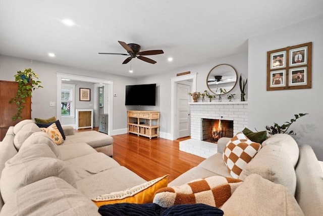 121 W St, Braintree, MA 02184 - living area featuring ceiling fan, a brick fireplace, wood finished floors, recessed lighting, and baseboards