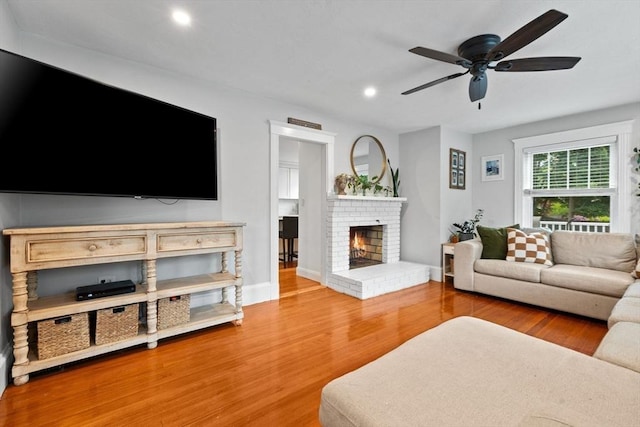 121 W St, Braintree, MA 02184 - living room featuring ceiling fan, recessed lighting, a fireplace, wood finished floors, and baseboards