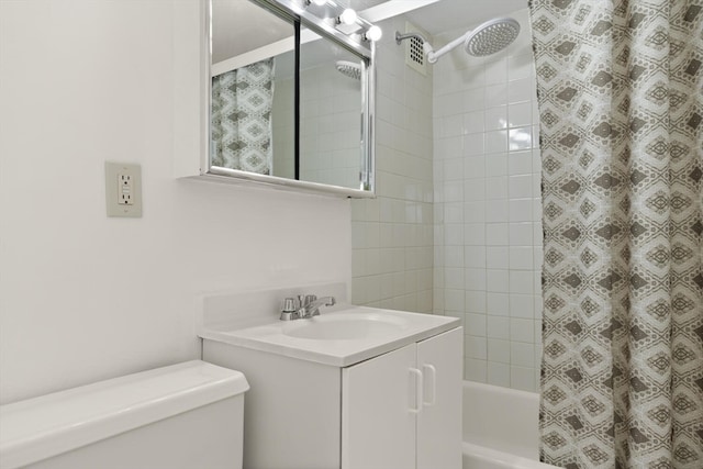 full bathroom with vanity, toilet, and shower / bath combination with curtain