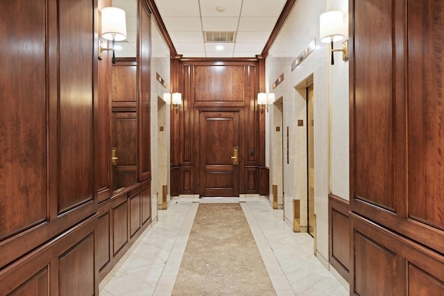 hall featuring light tile patterned floors