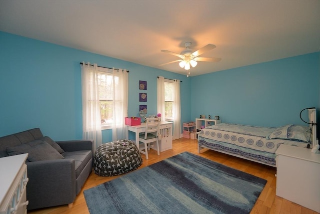 bedroom featuring ceiling fan and wood finished floors