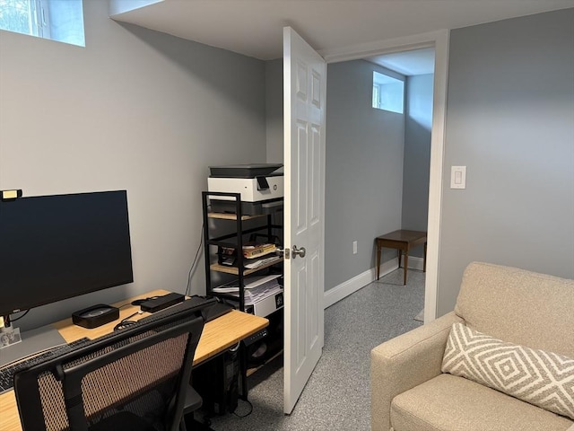 home office with baseboards and a healthy amount of sunlight