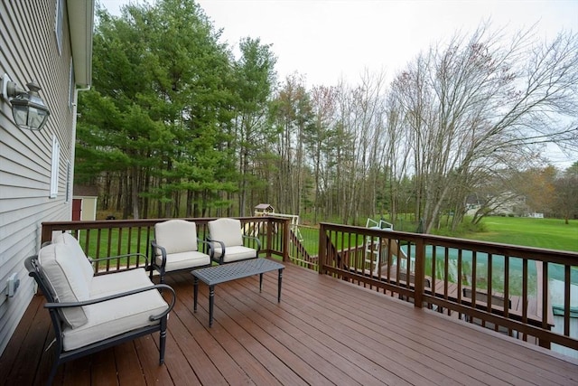 wooden terrace featuring a yard