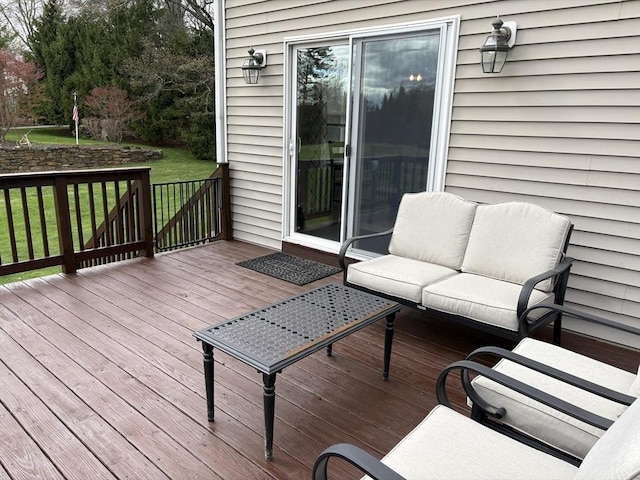 wooden deck with a lawn