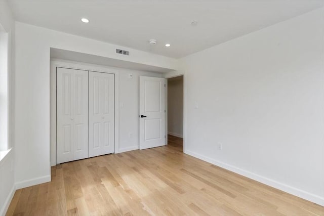 106 Broadway, Salem, MA 01970 - unfurnished bedroom with light wood-style floors, baseboards, recessed lighting, and a closet