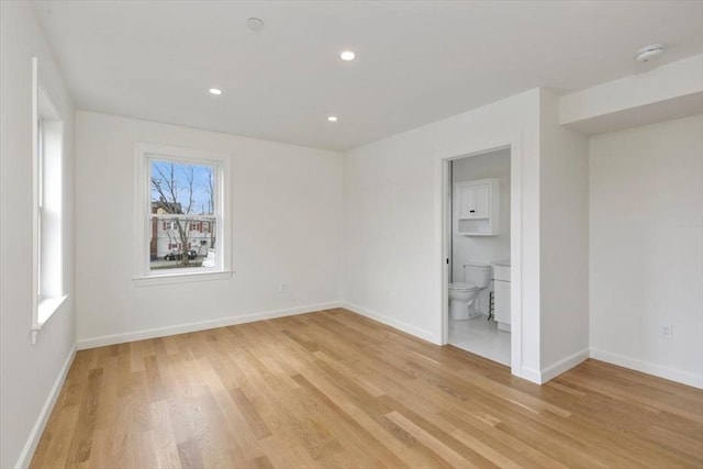 106 Broadway, Salem, MA 01970 - unfurnished bedroom featuring light wood-style flooring, baseboards, recessed lighting, and ensuite bath