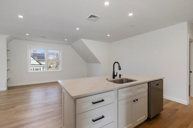 106 Broadway, Salem, MA 01970 - kitchen with dishwasher, a sink, light wood-style floors, white cabinets, and an island with sink