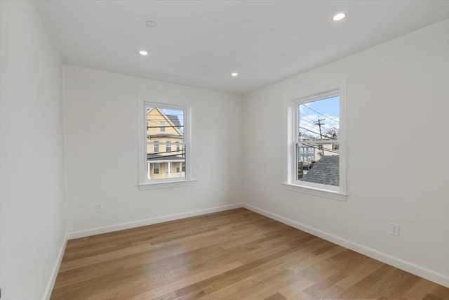106 Broadway, Salem, MA 01970 - spare room with healthy amount of natural light, baseboards, light wood-type flooring, and recessed lighting