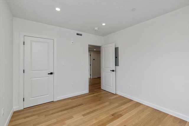 106 Broadway, Salem, MA 01970 - empty room featuring baseboards, light wood-style flooring, and recessed lighting