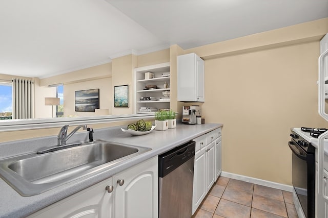 kitchen with light tile patterned flooring, white cabinets, stainless steel dishwasher, white range with gas cooktop, and sink