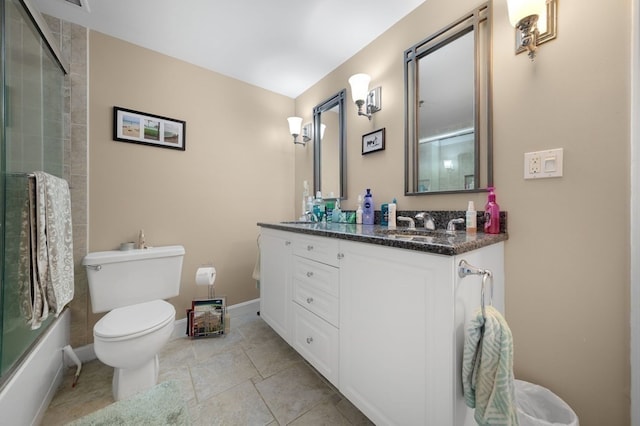 full bathroom with vanity, tile patterned flooring, shower / bath combination with glass door, and toilet