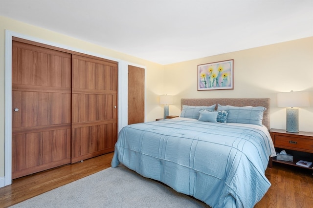 bedroom with hardwood / wood-style flooring