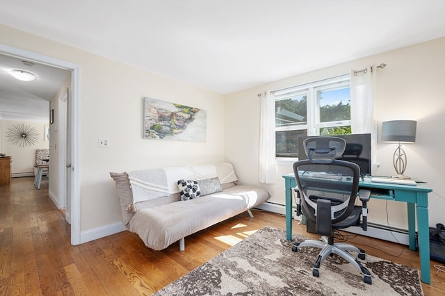 office featuring baseboard heating and wood-type flooring