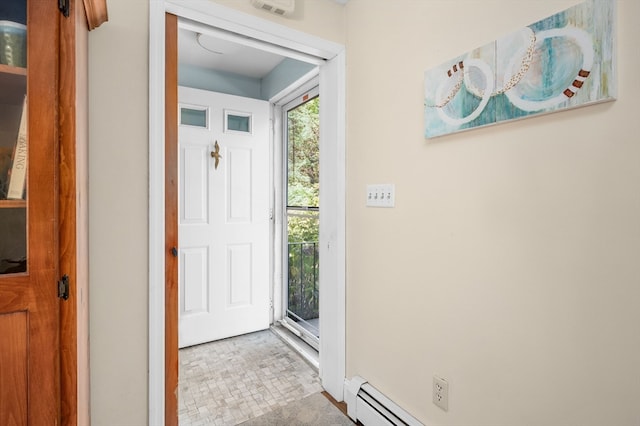 entryway with a baseboard radiator