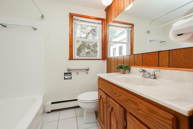 bathroom featuring tile patterned flooring, vanity, toilet, and a baseboard heating unit