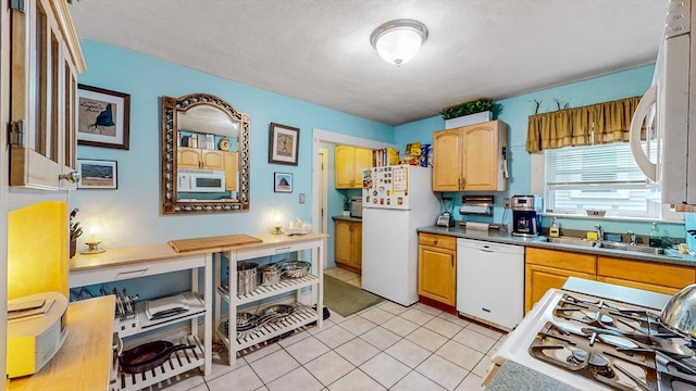 235-237 Corey Rd, Boston, MA 02135 - kitchen with white appliances and light tile patterned floors