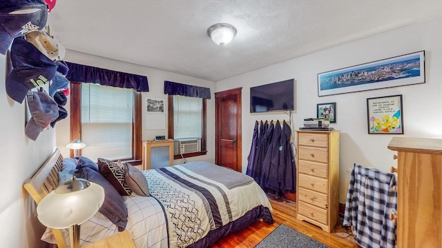 235-237 Corey Rd, Boston, MA 02135 - bedroom with a closet, wood finished floors, and cooling unit