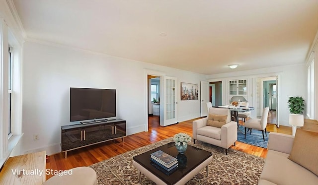 235-237 Corey Rd, Boston, MA 02135 - living area featuring wood finished floors, crown molding, and french doors