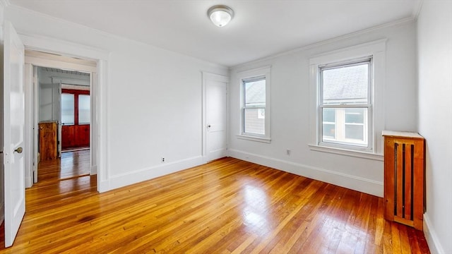 235-237 Corey Rd, Boston, MA 02135 - spare room featuring light wood-type flooring and ornamental molding