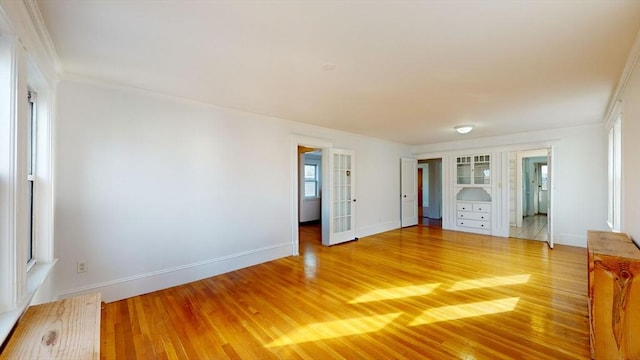 235-237 Corey Rd, Boston, MA 02135 - spare room with light wood-style flooring and crown molding